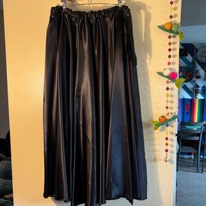 NWOT black satin belly dance or performance long maxi skirt featuring an e